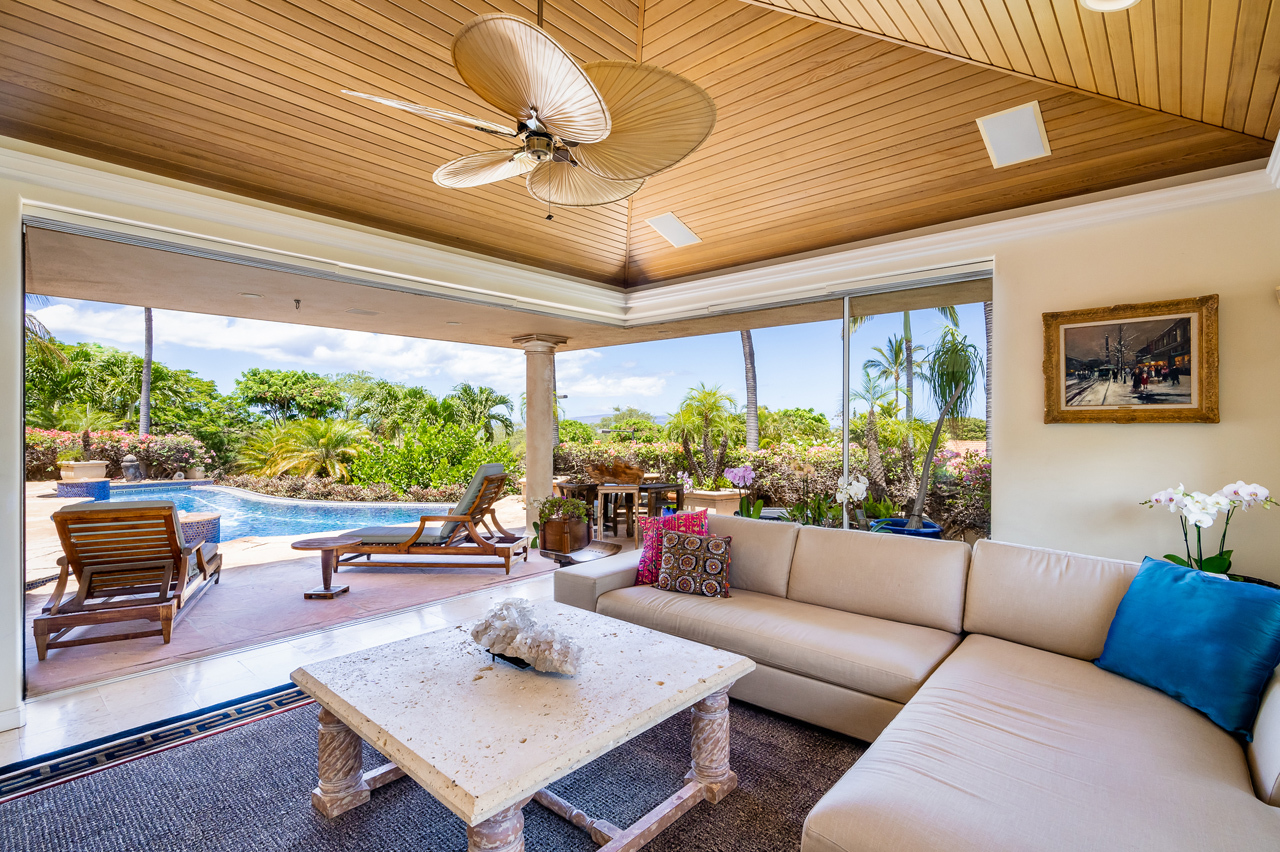 Graceful indoor & outdoor living: Living room has corner bevel pocket doors.